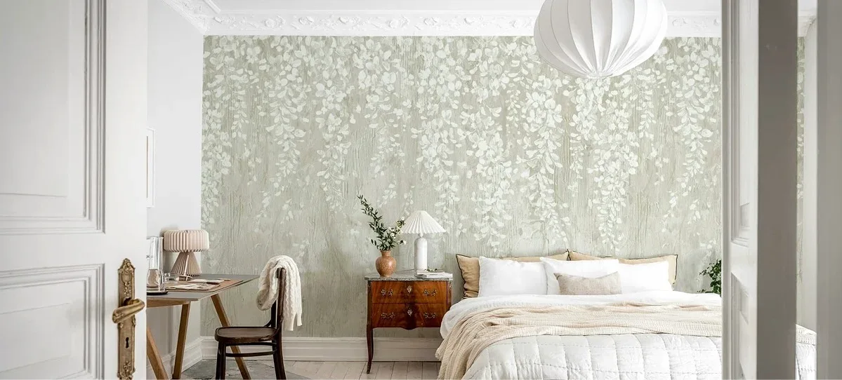 A bedroom with a stunning floral wallpaper